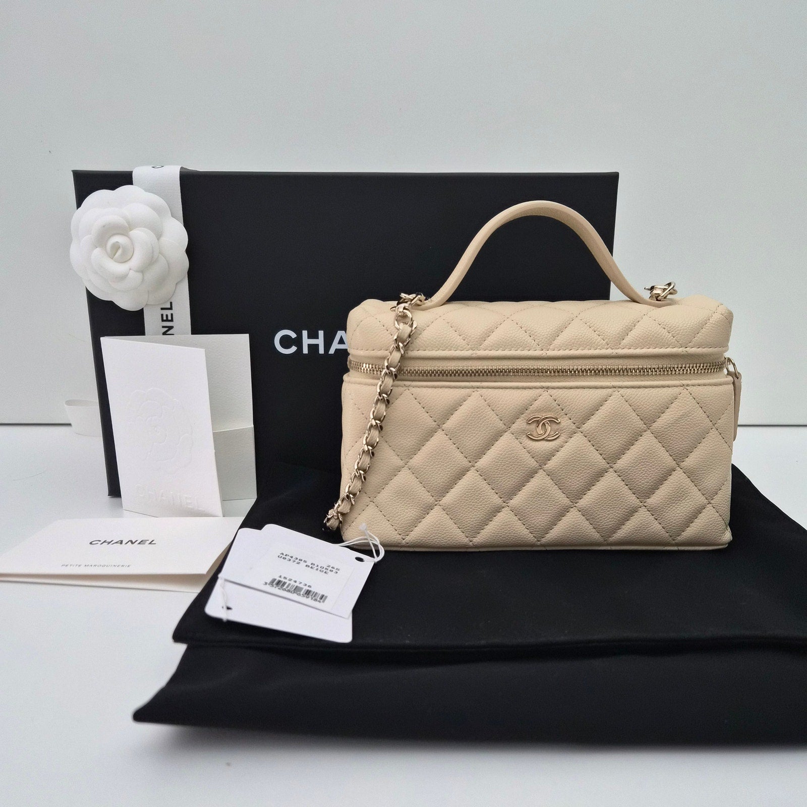 Chanel Caviar Quilted Top Handle Slim Vanity With Chain Beige
